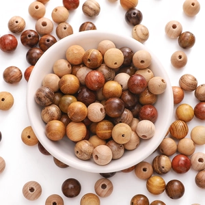 Polished natural wooden beads in various tones for DIY jewelry making and crafts