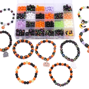 Macro shot of Halloween DIY jewelry set with orange, black beads and pumpkin charms
