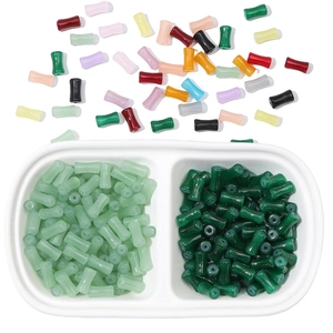 Macro view of colorful bamboo-shaped glass beads and jade-like DIY jewelry accessories