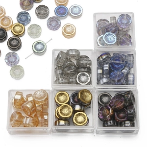 Colorful aurora glass flower beads for DIY jewelry making in a plastic organizer box