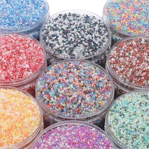 Close-up of 2.5mm colorful glass seed beads sorted in clear jars for DIY jewelry making