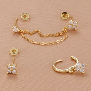 Detail view of 18K gold plated petal tassel earrings and studs set with zircon stones