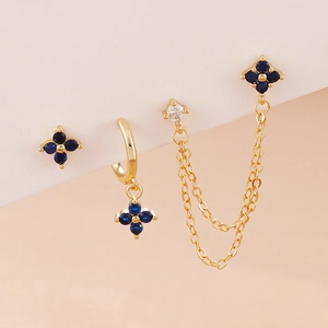 Detail view of gold-plated petal tassel earrings set with blue and white zircon stones