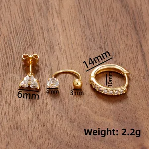 Detailed macro view of 3-piece gold stainless steel earring set with zircon inlay