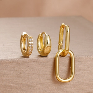 Detailed set of three gold-plated stainless steel earrings with zircon huggies and links