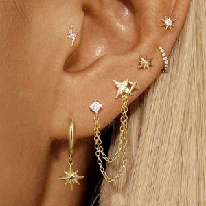 Goldenes Edelstahl Piercing-Set mit Zirkon Blitz Sternen und Kettenohrringen