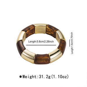 Detail shot of vintage acrylic bead bracelet showing dimensions and amber resin texture