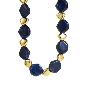 Macro view of blue marble resin beads and irregular gold textured beads on necklace