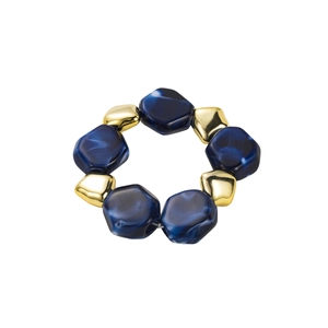 Detail of elastic bracelet with dark blue marbled resin and gold metal geometric beads
