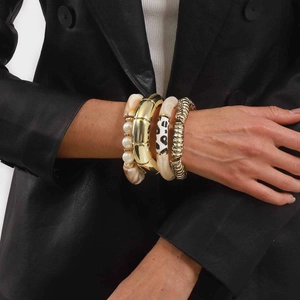 Retro resin pearl bracelets set with gold metal bangle and amber texture on wrist