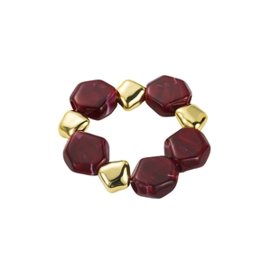 Close-up of fashionable beaded necklace with hexagonal red beads and golden metal squares