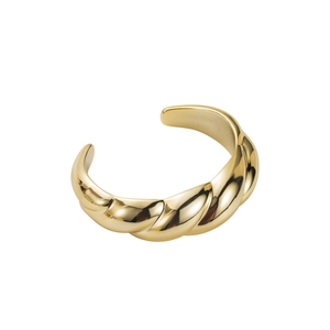 Macro shot of gold twisted rope ring with high-polish metallic texture on white background