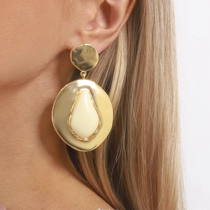 Chic oversized geometric gold teardrop earrings with textured metal and resin stone