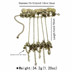 Detail showing vintage bohemian hand harness with bronze coins and intricate engravings