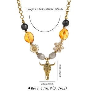 Detailed view of beaded necklace with gold bull head pendant and size specifications