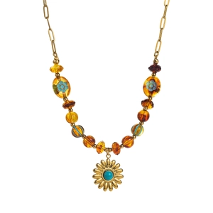 Detail of bohemian gold chain with amber beads, floral charms and turquoise sun pendant