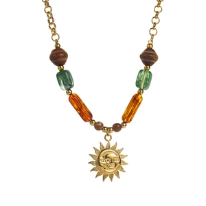 Detail of beaded necklace with sun pendant, wooden beads, and green marble resin