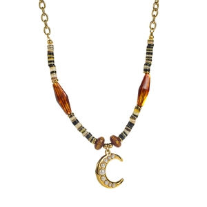 Detail of vintage gold moon pendant with pearl inlay and multicolored beaded chain links