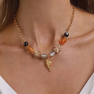 Vintage bohemian beaded necklace with golden chain and bull skull pendant for women