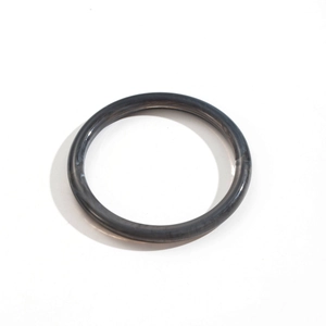 Detail of dark grey marble texture resin bangle with modern geometric acrylic design
