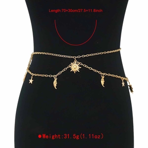 Detail view of gold bohemian waist chain with sun moon and star charms for women