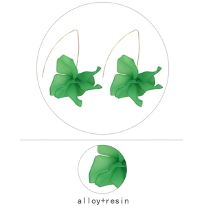 Detail of green resin flower earrings with gold alloy hooks and layered petal texture