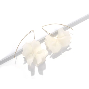 Long white floral drop earrings with layered resin petals and gold curved hooks