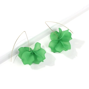 Detail of green resin floral drop earrings with long elegant gold metal hooks