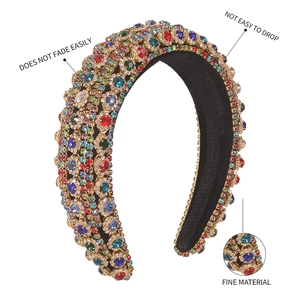 Detail of baroque padded headband featuring multi-color crystals and fine metal setting