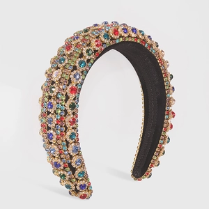 Close-up of luxury Baroque headband featuring colorful rhinestones and padded design
