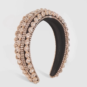 Macro detail of luxury baroque sponge headband with champagne and clear rhinestones