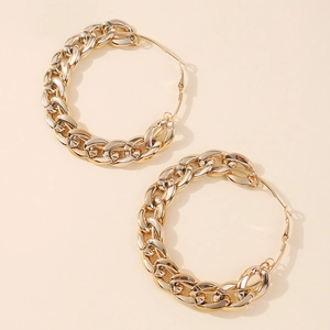 Close-up of chunky gold hoop earrings with thick chain texture and polished finish