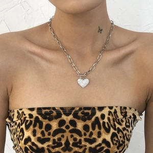 Punk style chunky silver chain necklace featuring a sparkling heart-shaped rhinestone pendant