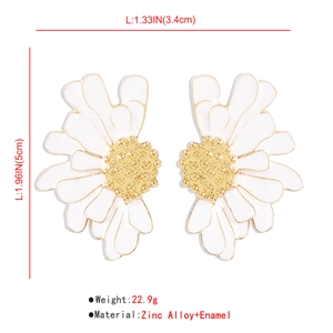 Detailed view of large vintage daisy earrings with white enamel petals and gold center