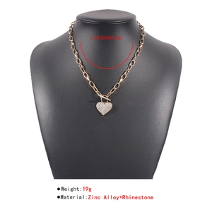 Detailed size and weight specs for a gold heart pendant necklace with rhinestone and OT buckle