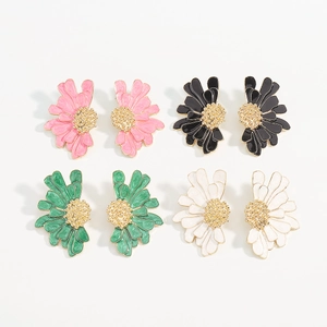 Detail of four pairs of daisy enamel flower stud earrings in pink black green and white