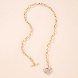 Chunky gold punk chain necklace with a sparkling rhinestone heart pendant and T-bar clasp