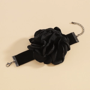 Detailed view of black velvet choker featuring a large 3D fabric rose and metal lobster clasp
