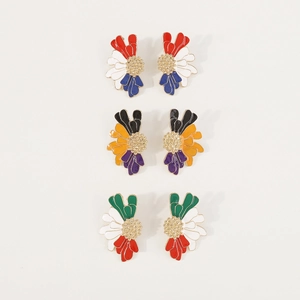 Detailed close-up of three pairs of vintage enamel flower earrings in vibrant colors