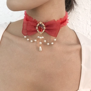 Retro red lace choker necklace with bow, gemstone pendant, and pearl tassel details