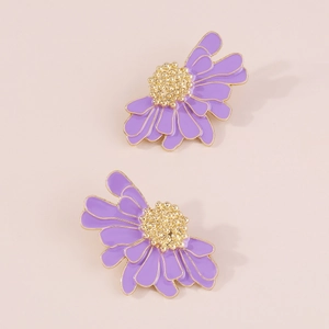 Detailed close-up of purple enamel flower earrings with golden stamen and textured petals