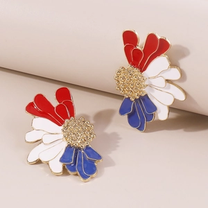 Close-up of red, white and blue enamel petal earrings with gold bead center detail