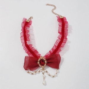 Detail showing red lace Lolita choker with bow, center gemstone and pearl pendants