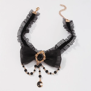 Detail of gothic lace choker with black bow, velvet ribbon and star moon charms