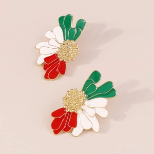 Macro shot of vintage daisy earrings with green white and red enamel petals and gold plating