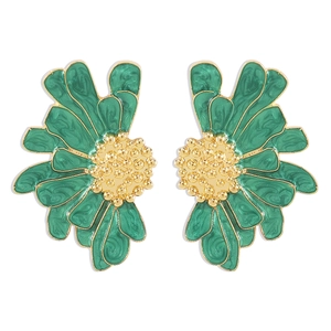 Macro detail of retro daisy earrings with green enamel and gold plated flower texture