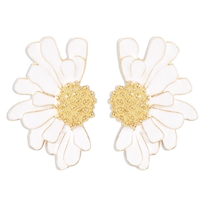 Detail of white daisy stud earrings featuring enamel petals and golden textured center