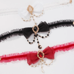 Retro bow necklace with faux pearls and star-moon pendants in black, white, and red