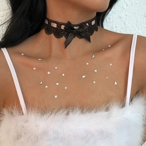 Elegant black lace choker with satin bow and decorative rhinestone crystal skin gems