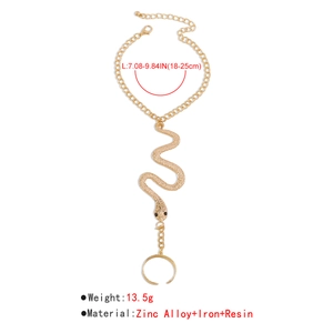 Detailed view of gold snake finger bracelet set with zinc alloy and resin materials